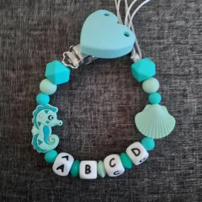 Attache sucette coeur et hippocampe