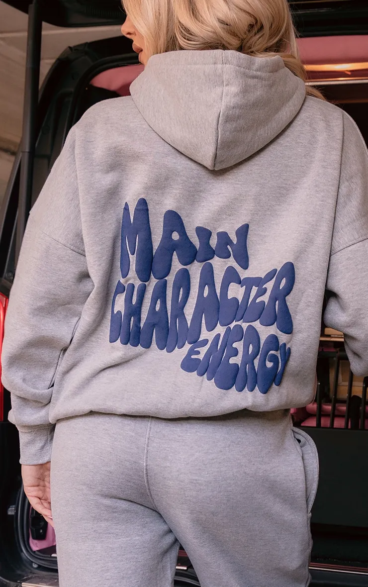 Hoodie gris cendré oversize à slogan Main Character Energy en relief