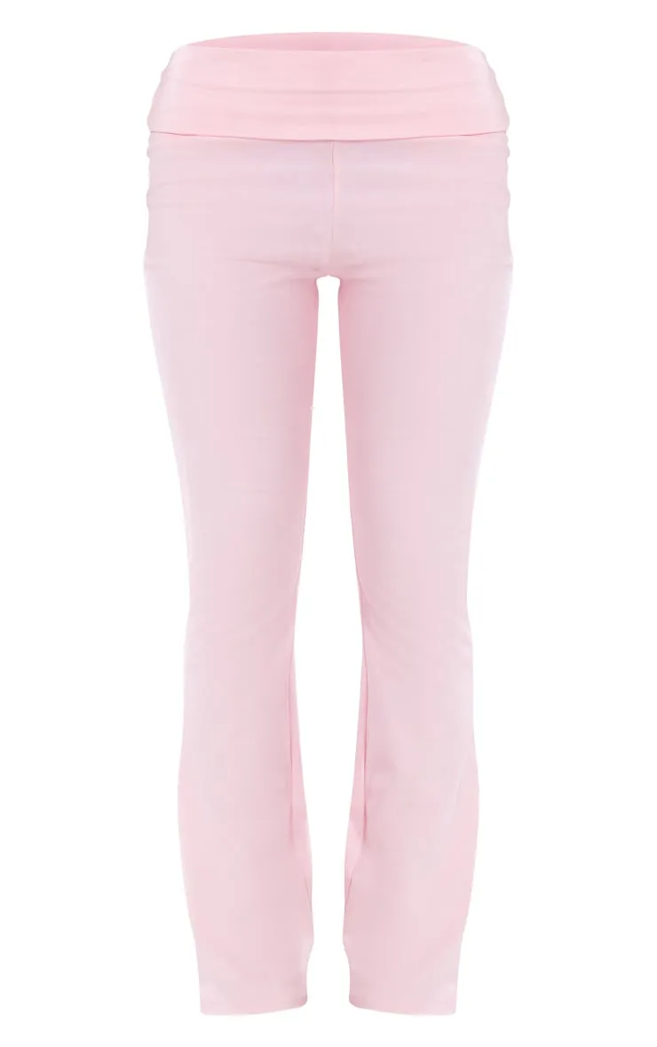 Pantalon flare en coton rose pâle replié